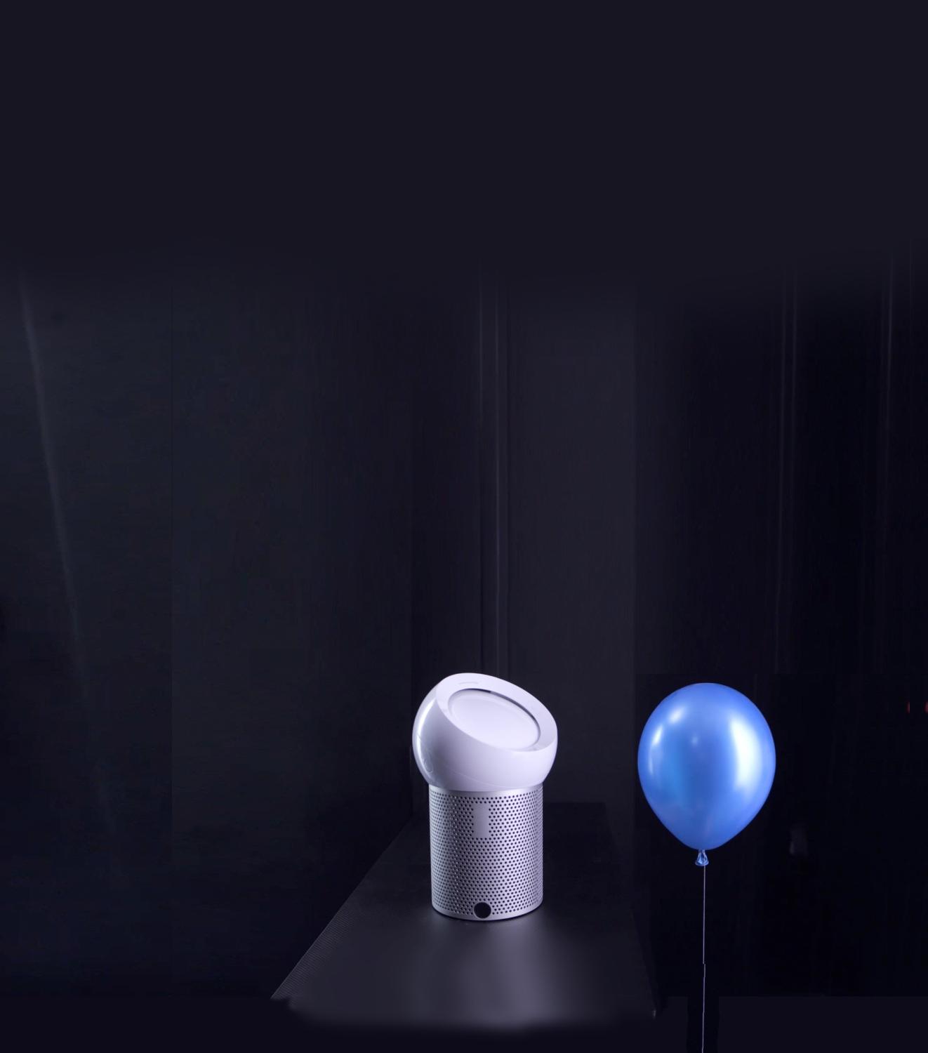 Dyson Pure Cool Me using focused airflow to steer a blue balloon diagonally away from it