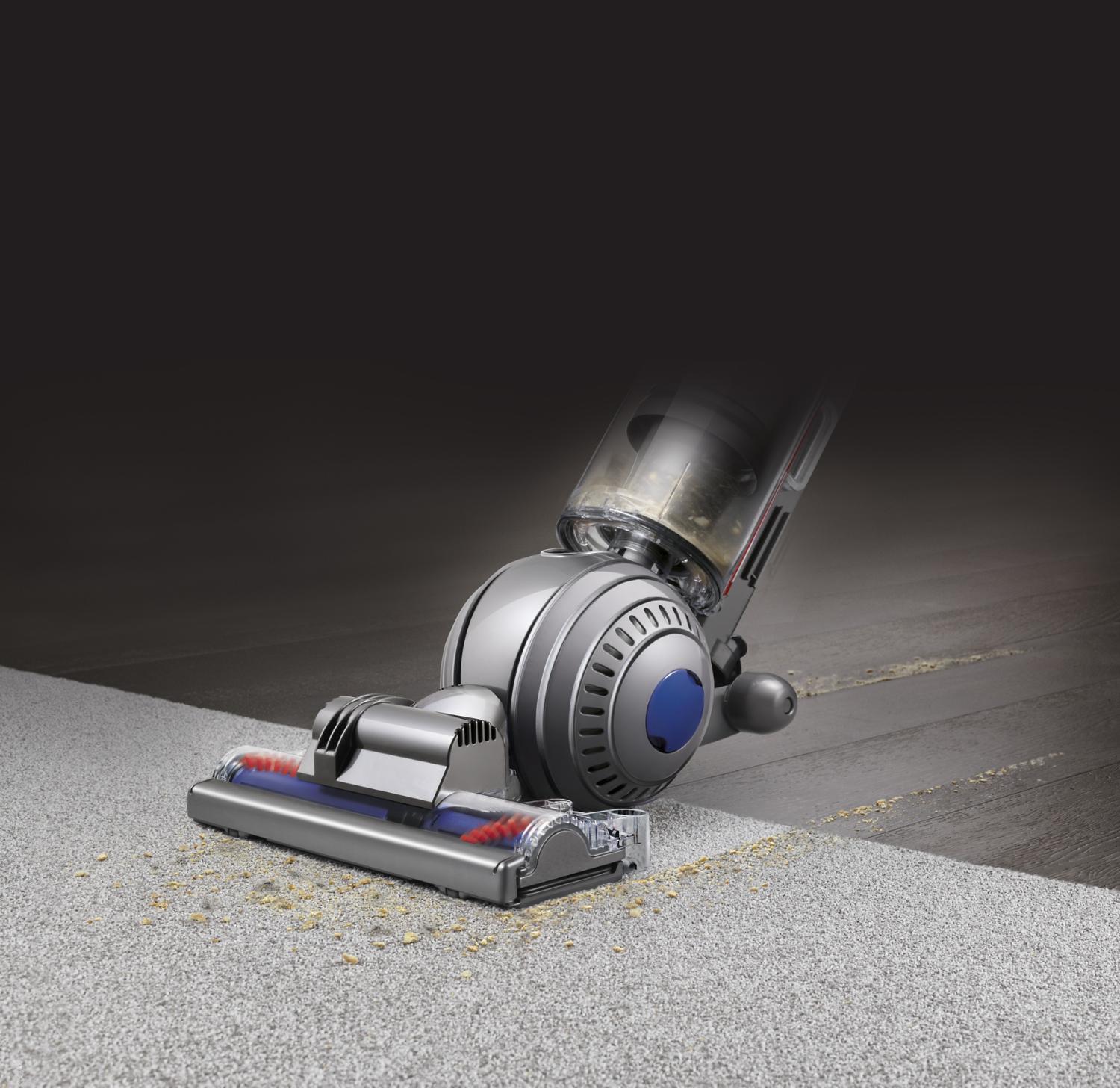 Close up of Light ball cleaner head picking up dirt across different floor surfaces