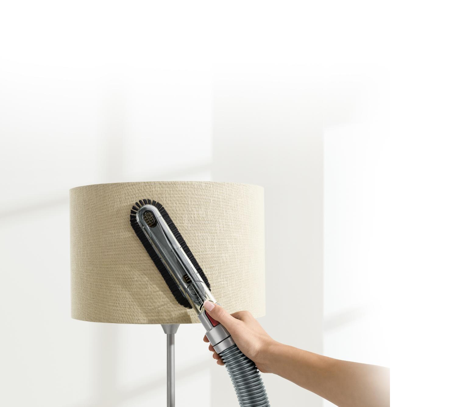 Soft dusting brush on lampshade.