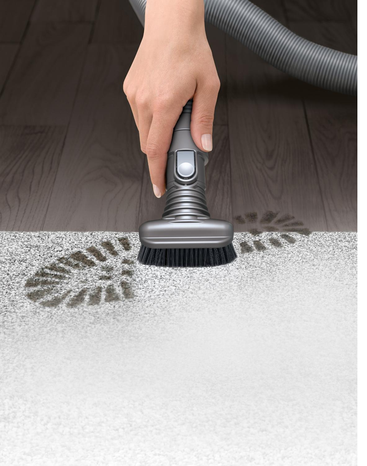 Stiff bristle brush cleaning away a footprint