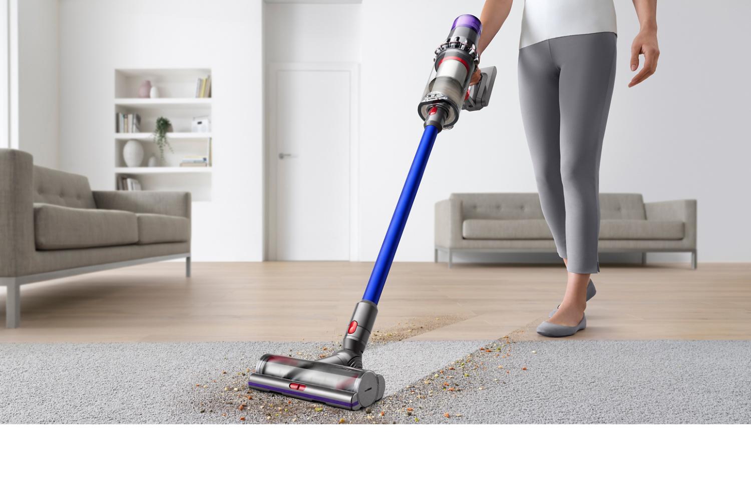 Dyson V11 motorhead picking up debris across multiple surfaces