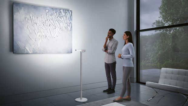Dyson Lightcycle Morph floor light for showcasing art on a wall