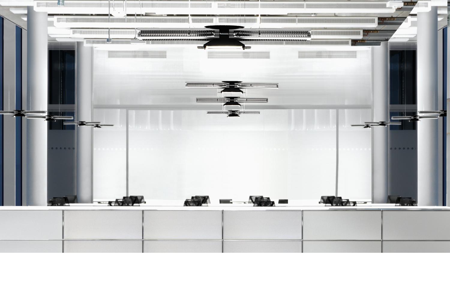 Dyson lights hanging over office desks