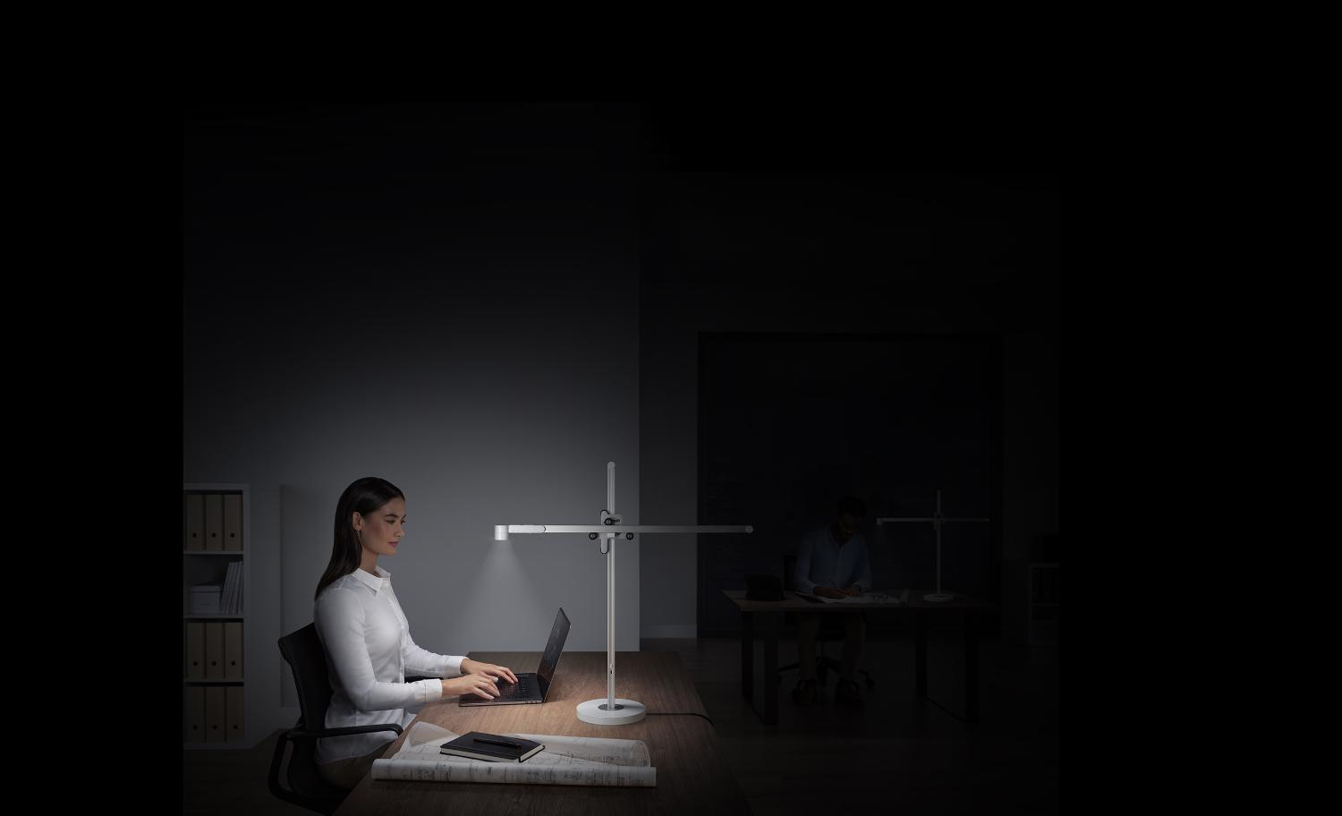 2 models using Dyson light cycle desk to work