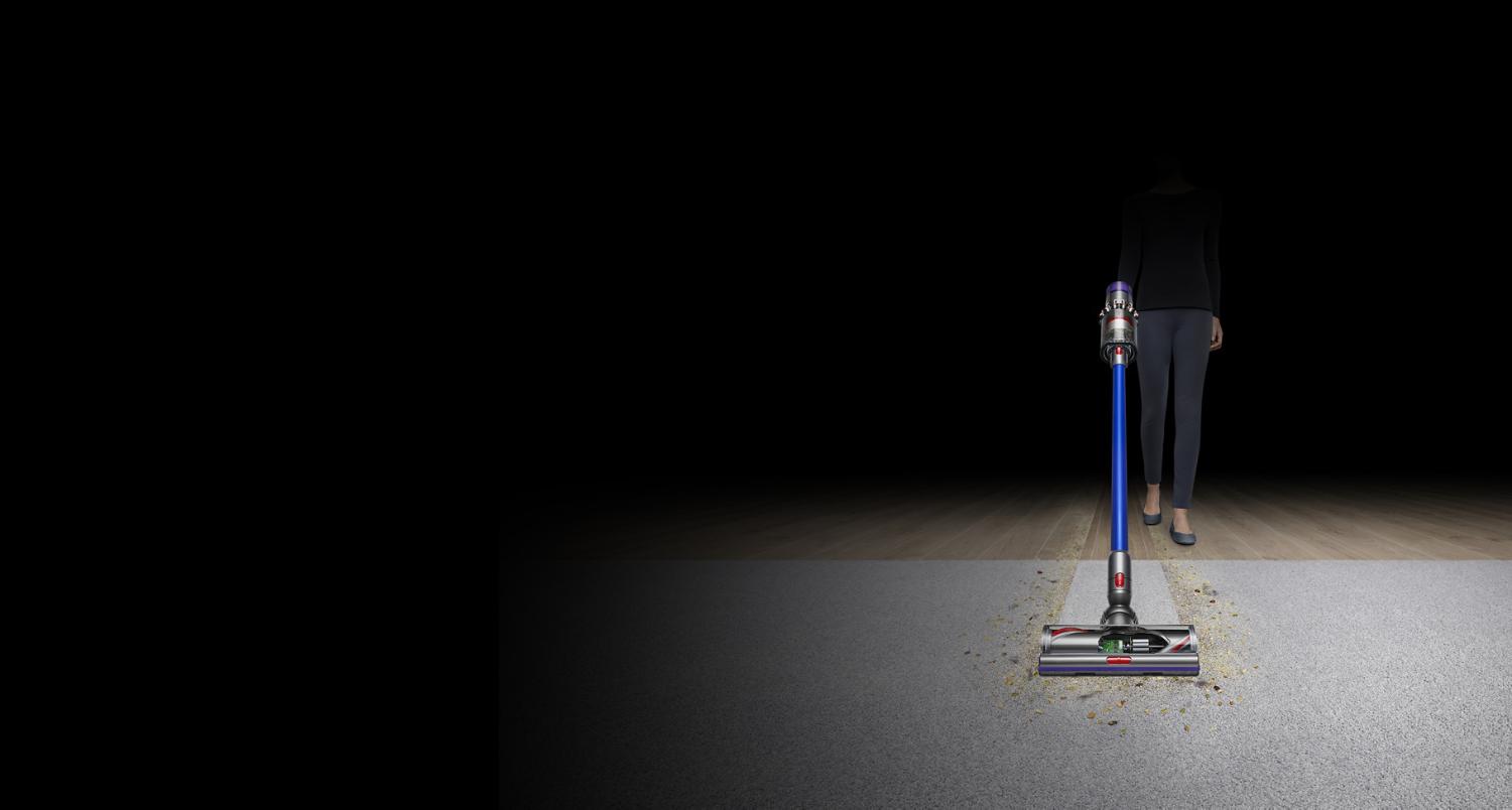 Dyson V11 Vacuum picking up dirt from a carpet