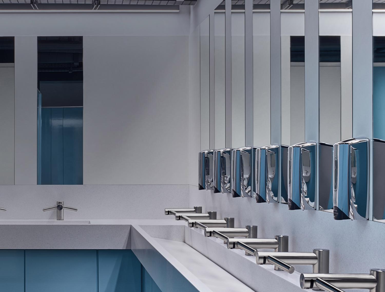 Dyson Airblade Tap hand dryers in public bathroom