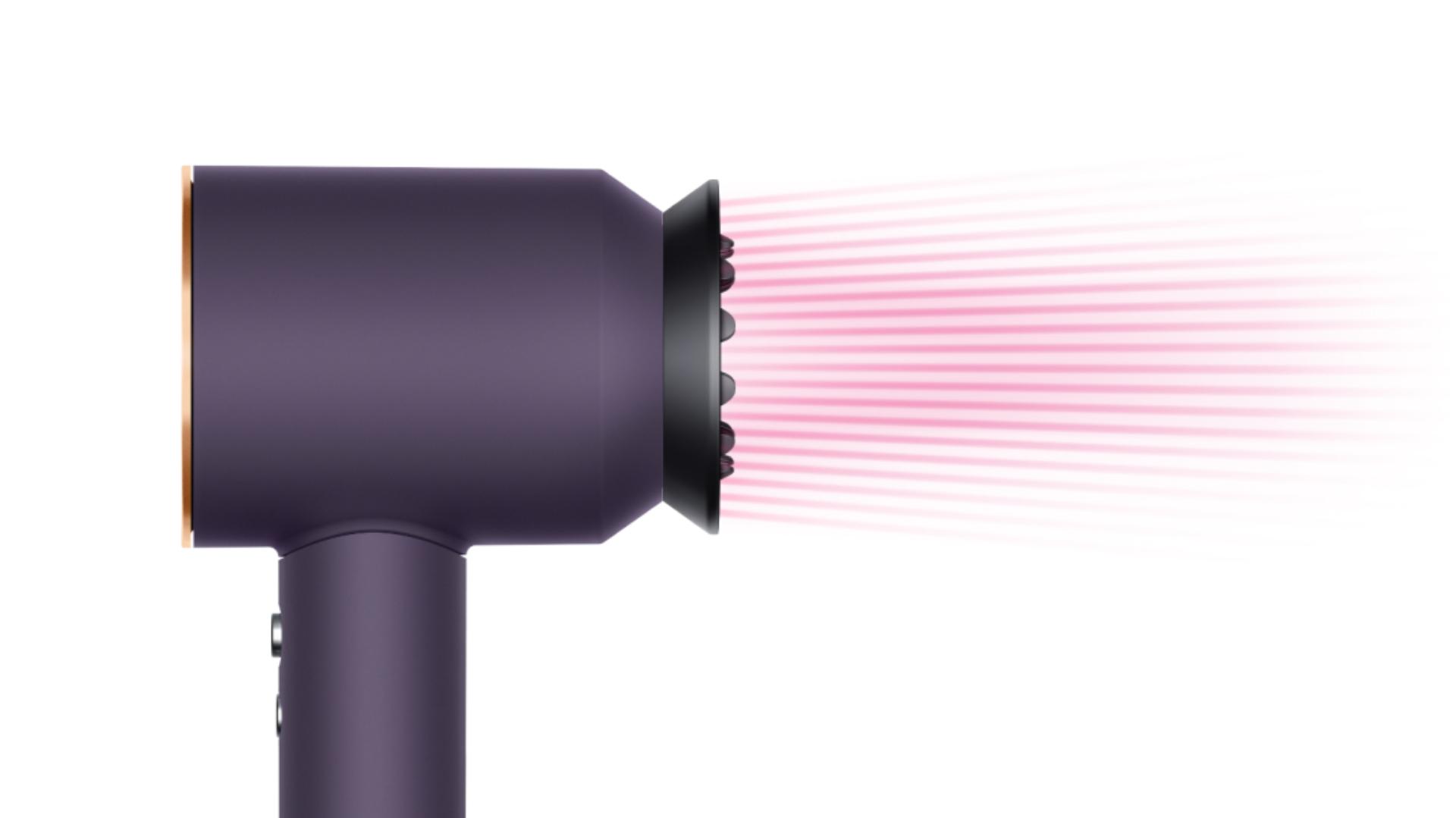 The Dyson Supersonic Professional hair dryer in Bright copper with the Gentle air attachment.