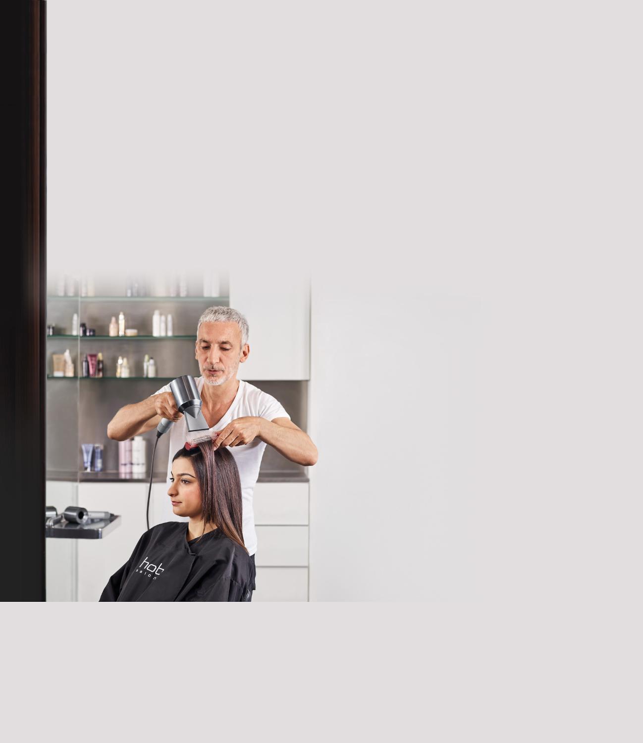 Close up of the Dyson Supersonic™ Professional hair dryer in use