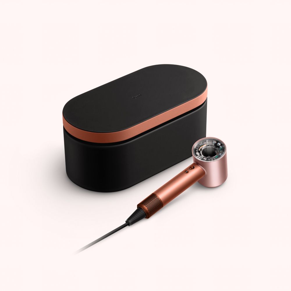 Uscătorul de păr Dyson Supersonic Nural și cutia pentru depozitare.