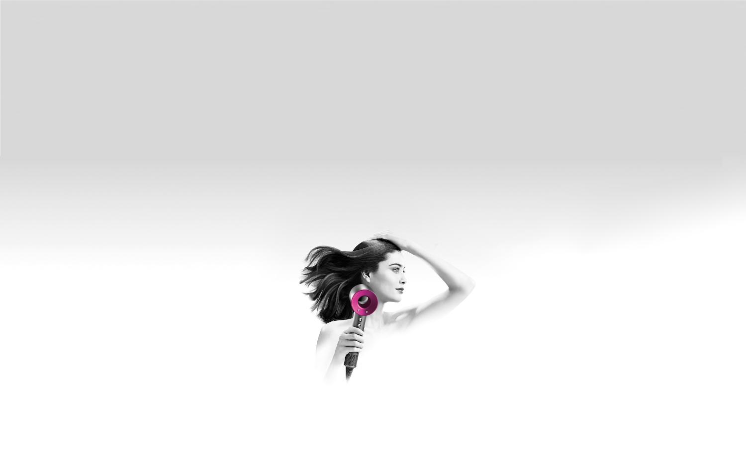 Model using Dyson Supersonic™ hair dryer