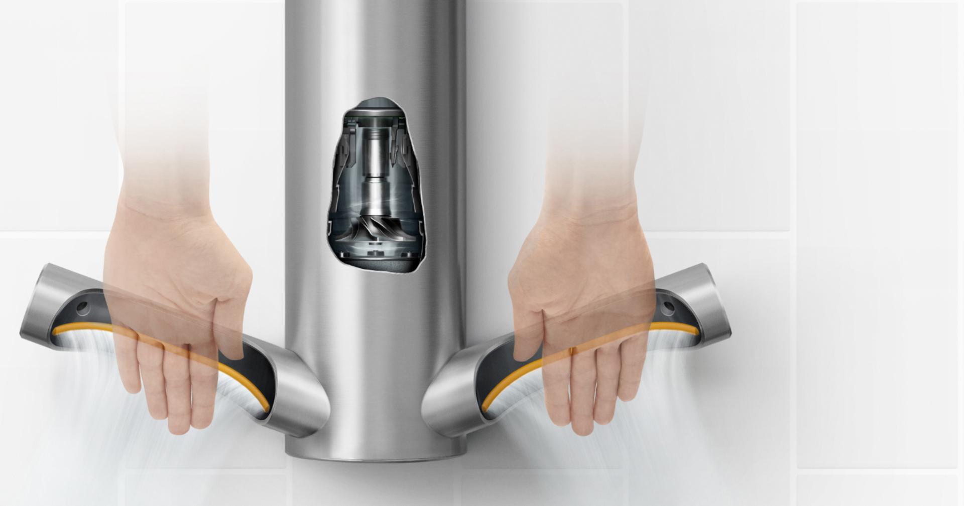Model drying hands under the Dyson Airblade 9kJ hand dryer.