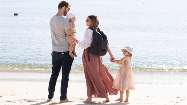 Leah family on beach with Dyson backpack
