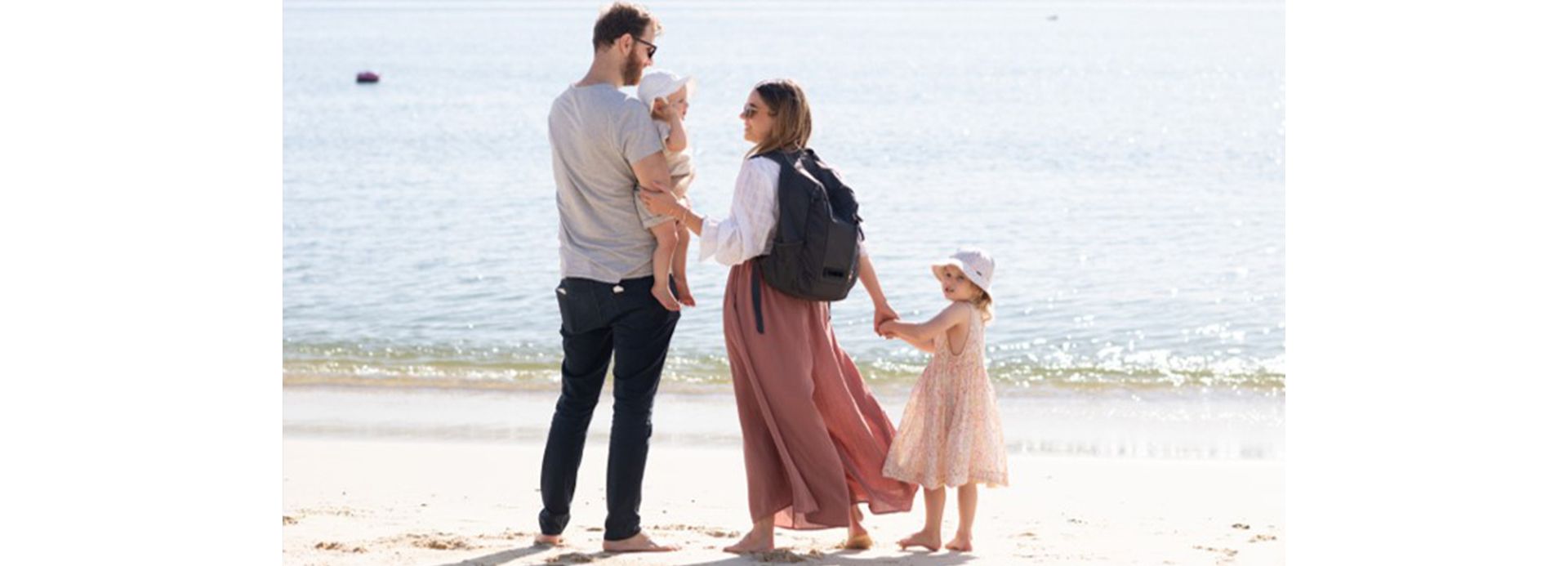 Leah family on beach with Dyson backpack
