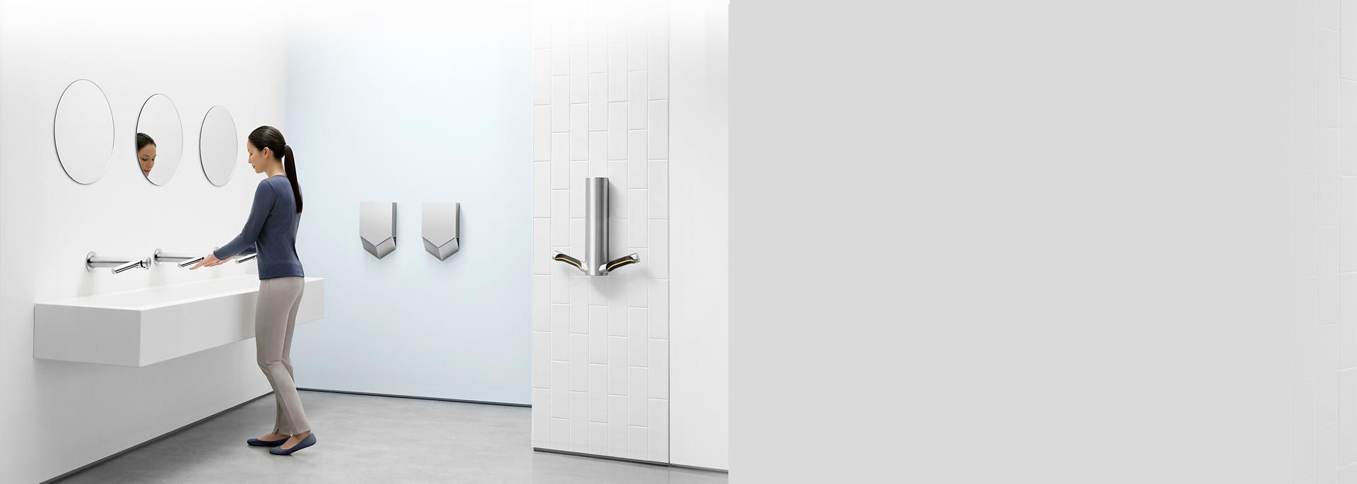 Dyson Airblade hand dryers mounted in a washroom