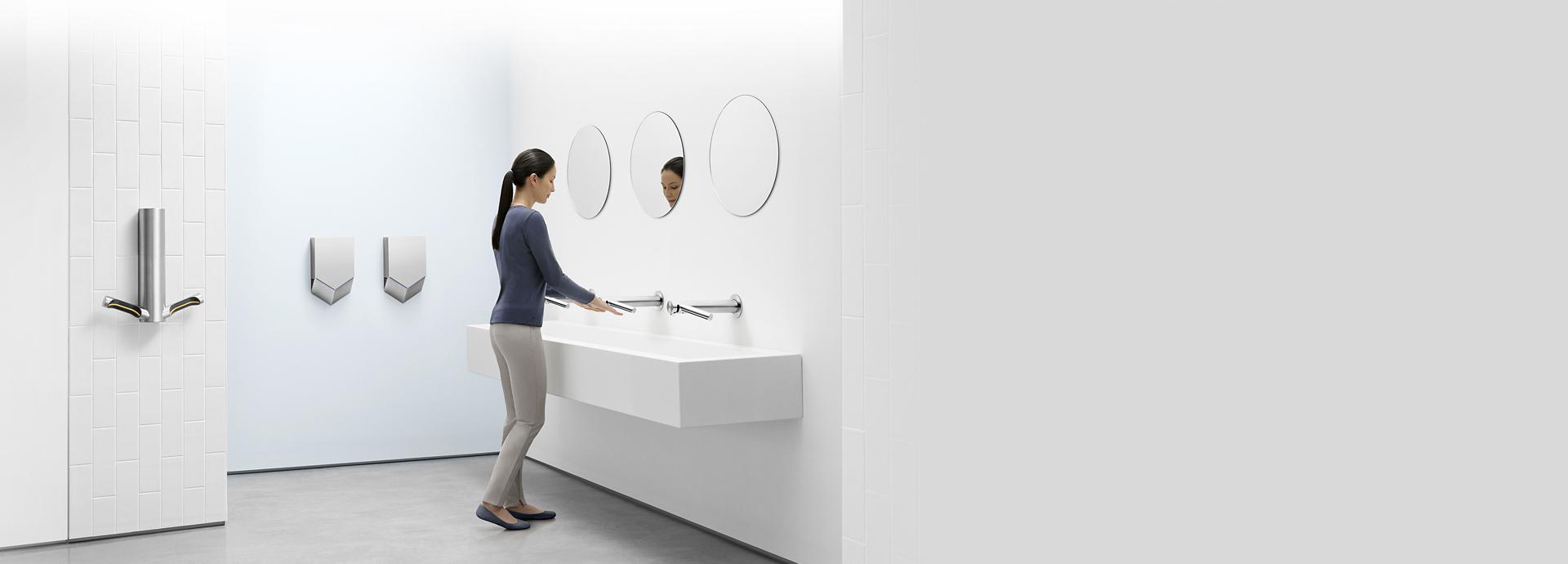 Dyson Airblade hand dryers mounted in a washroom