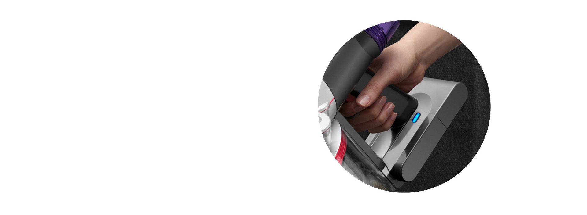 A close up of the Dyson V8 Focus with the battery light illuminated.
