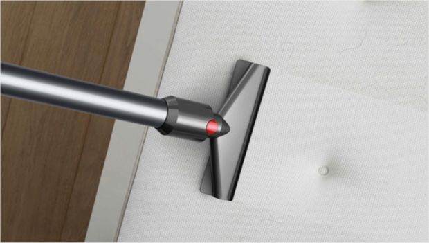 Fabric and mattress tool cleaning a mattress