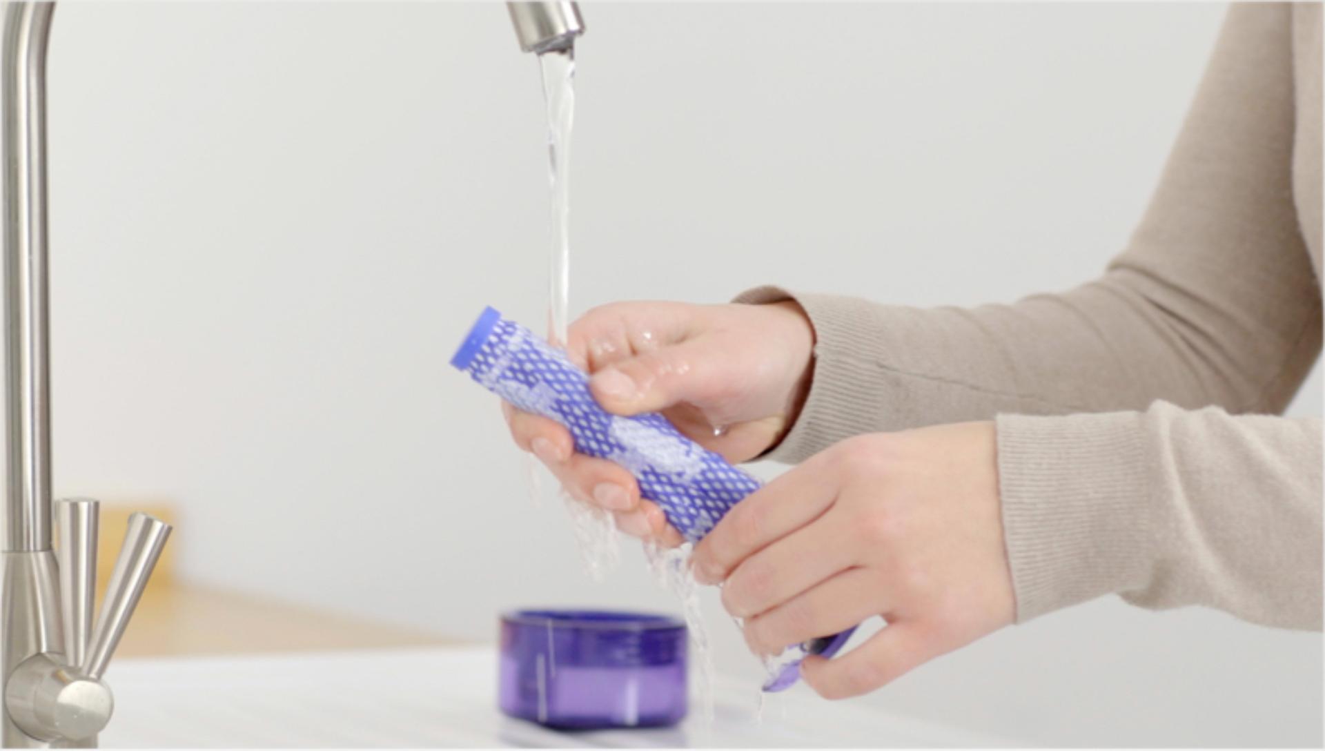 Filters A being washed under running water