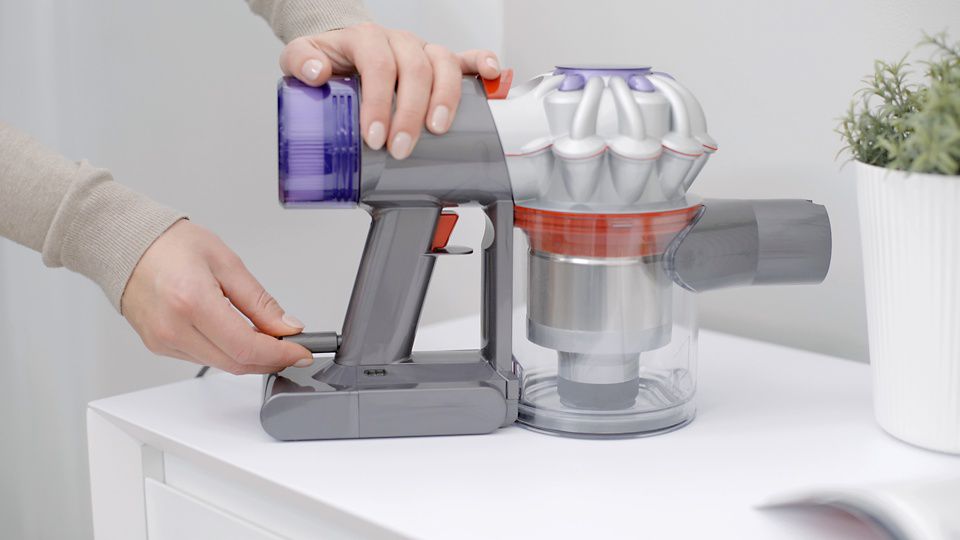 The charging cable being plugged in to the Dyson V8 Focus.