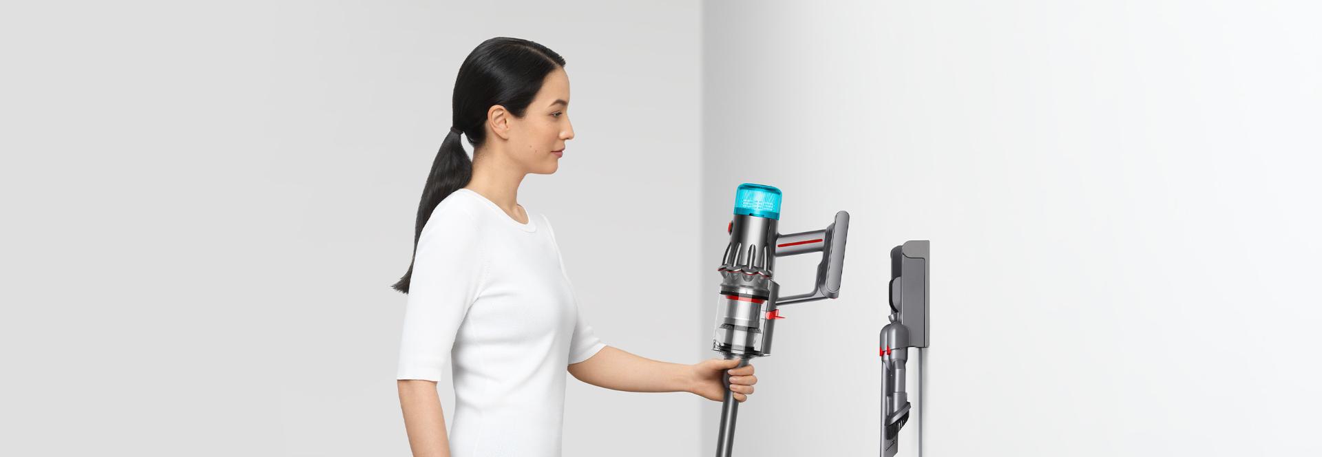 A woman assembling the V12 origin vacuum cleaner.