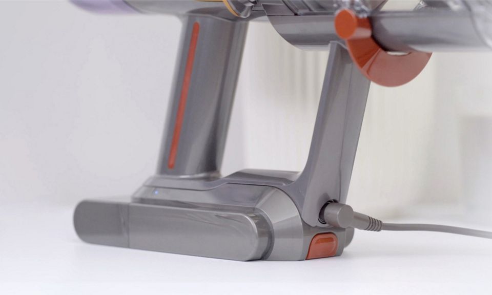 Dyson V12 Origin plugged into charge