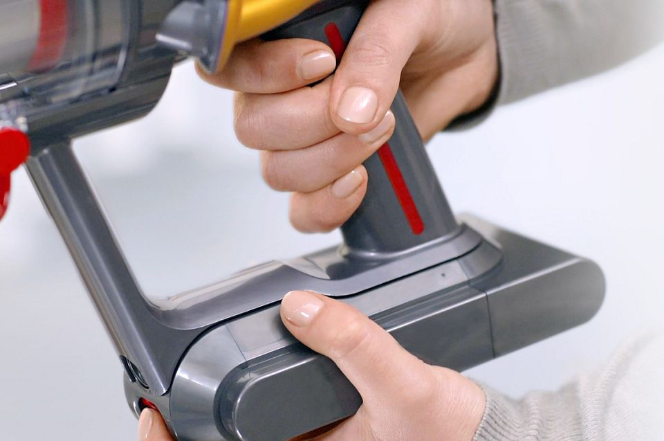 Battery being removed from the Dyson V12 Origin