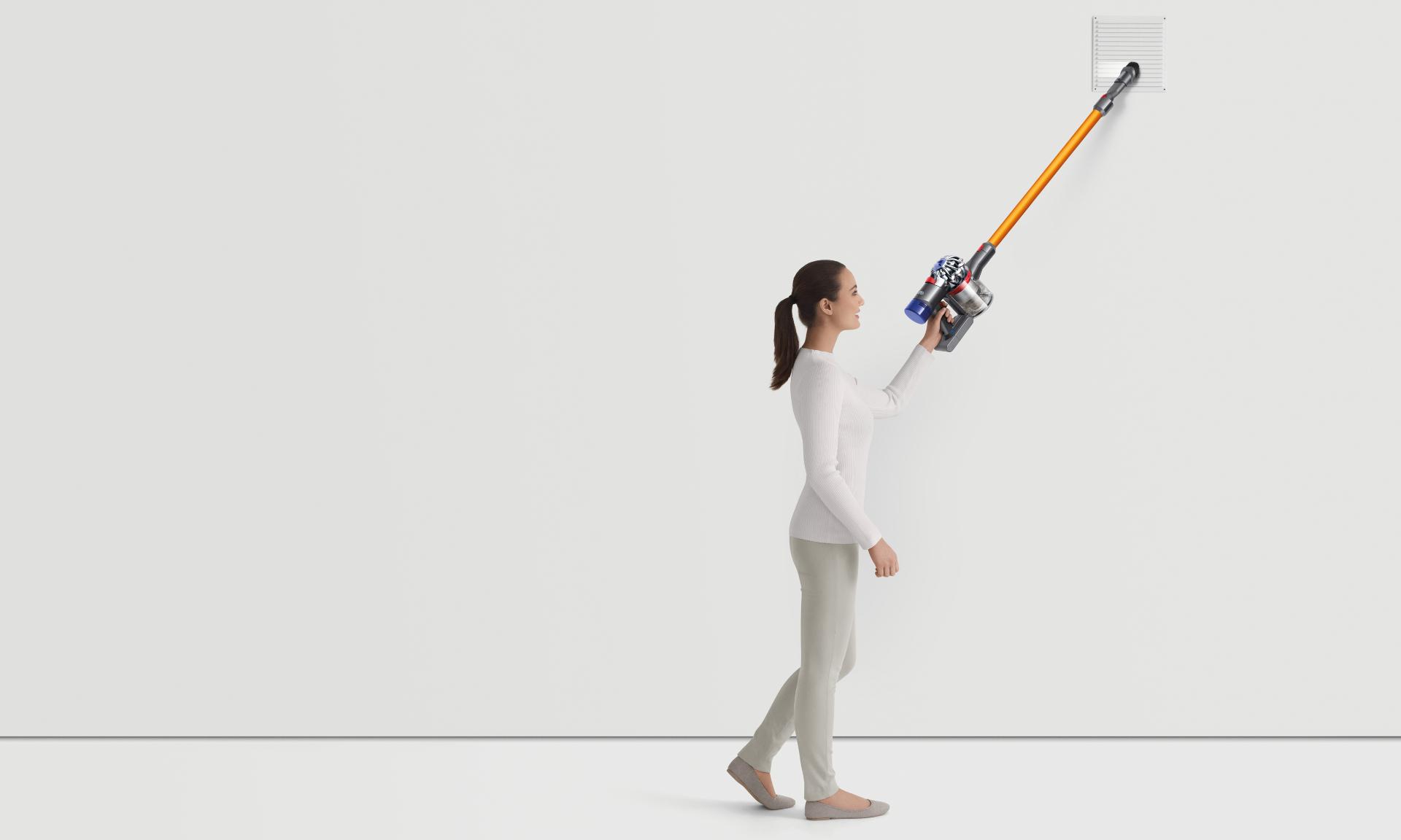 Woman cleaning with the Dyson V8 vacuum cleaner in a variety of scenarios