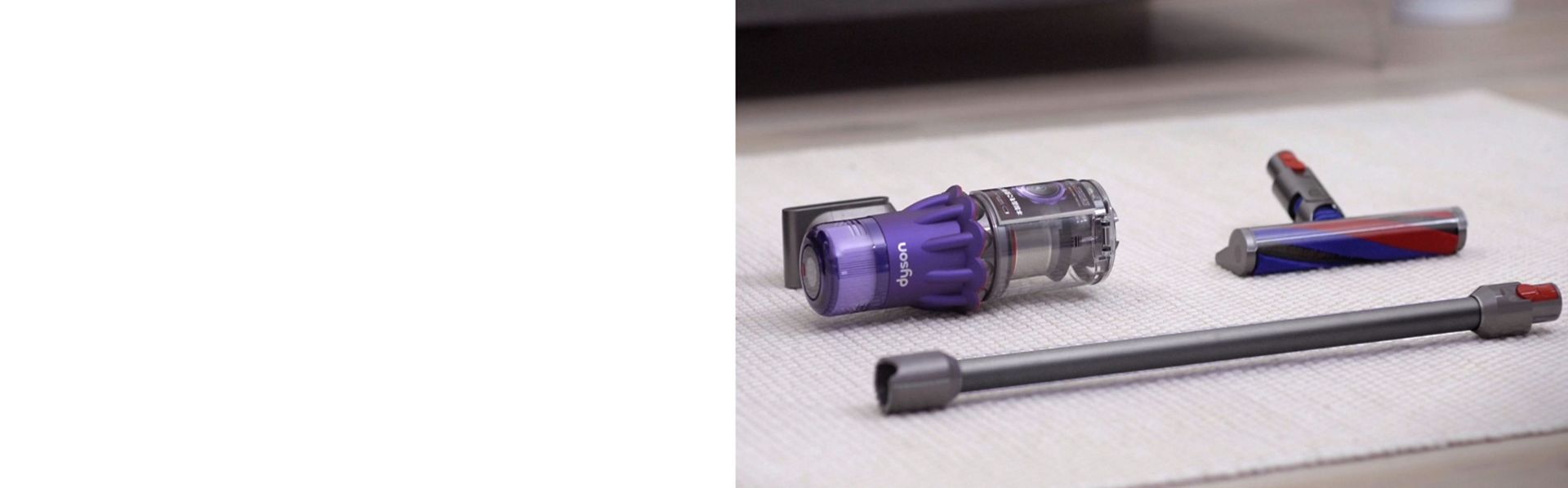 The Dyson V9 vacuum resting on a surface with the Motorbar cleaner head and wand.