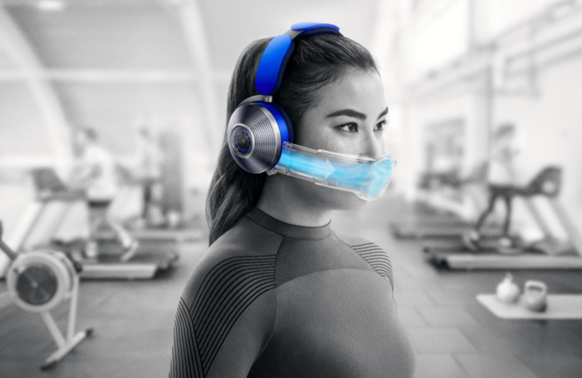Woman wearing the Dyson Zone air-purifying headphones in a gym.