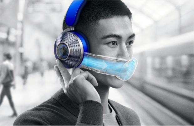 Man wearing the Dyson Zone air-purifying headphones in a railway station.