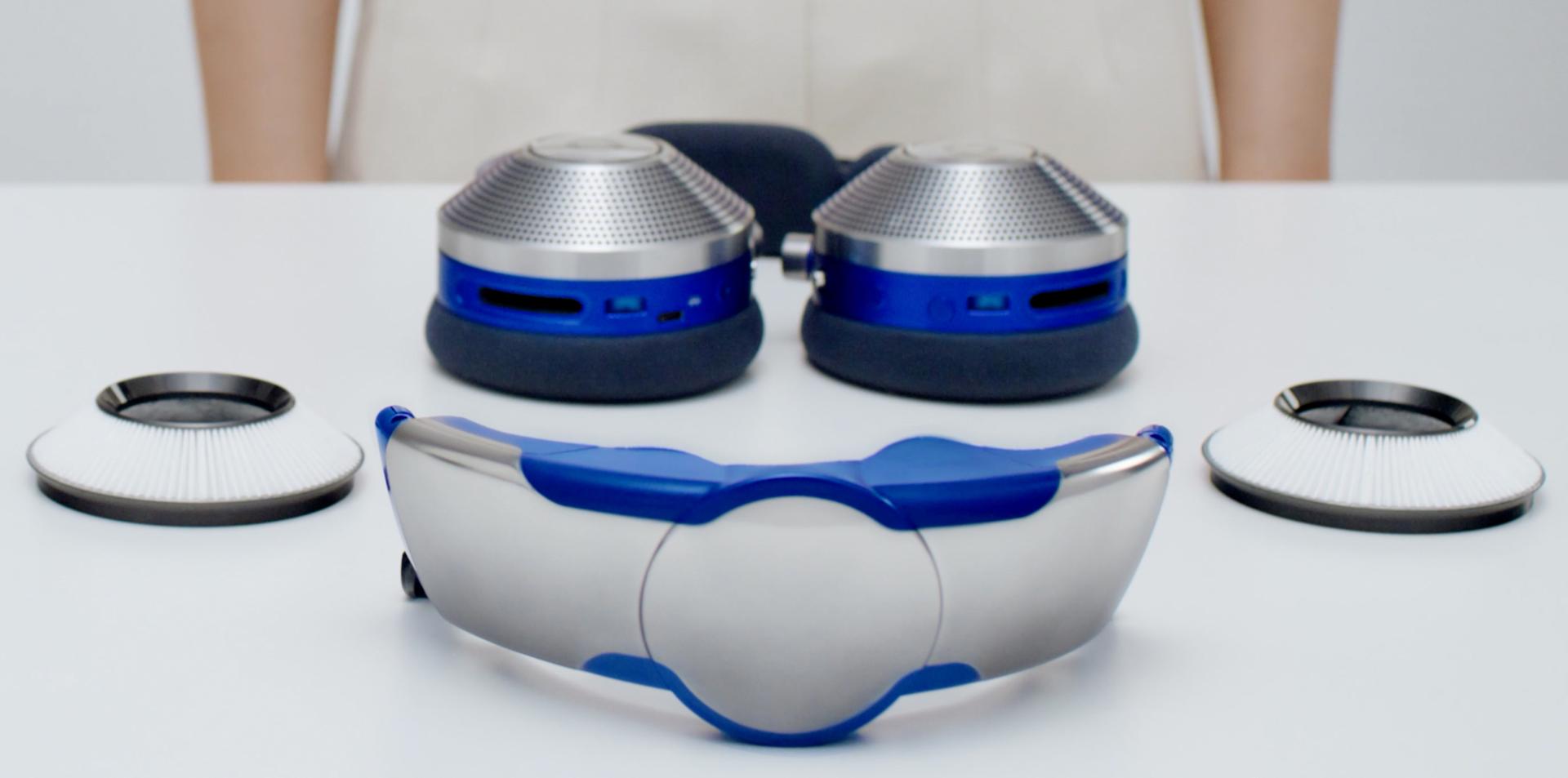 All the parts of the Dyson Zone air-purifying headphones on a table top, ready to set up and connect.