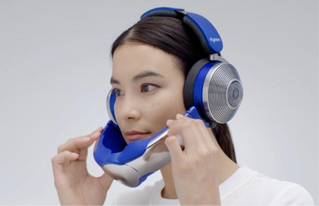 Woman attaches the visor using the magnetic connectors.