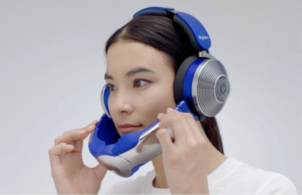 Woman attaches the visor using the magnetic connectors.