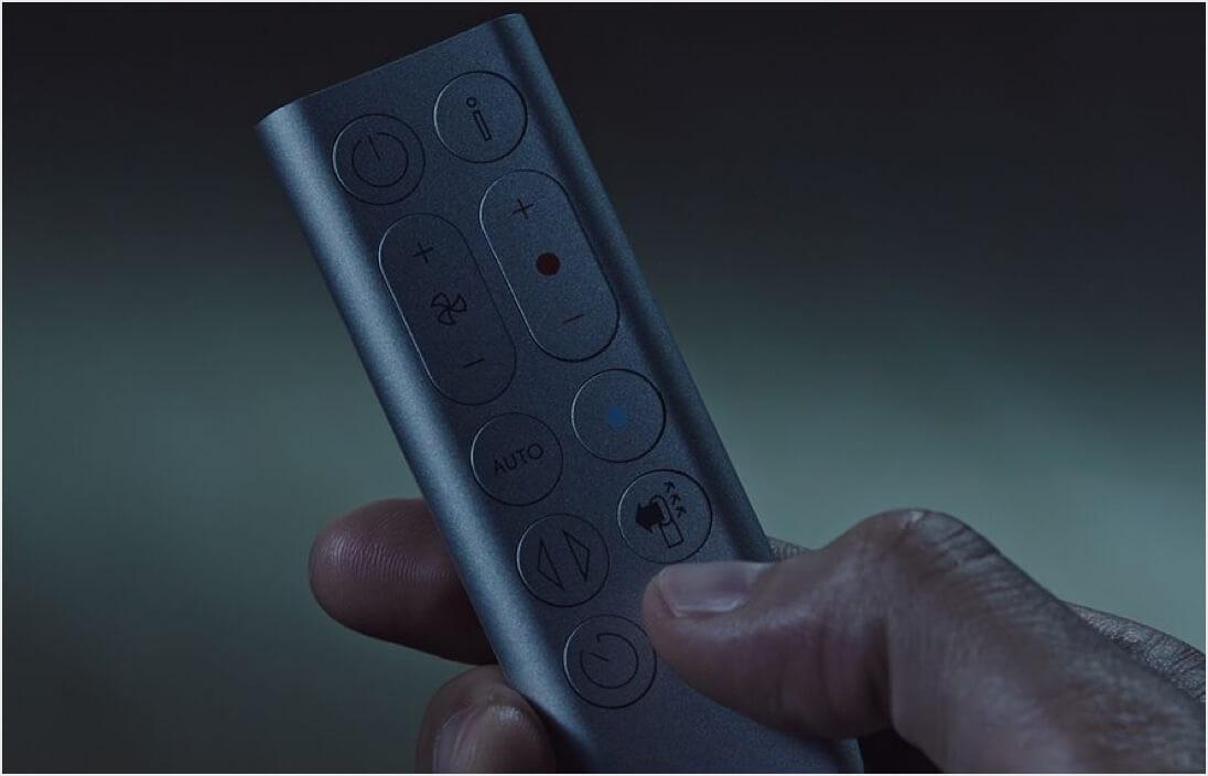 Person setting the Sleep timer using the remote control
