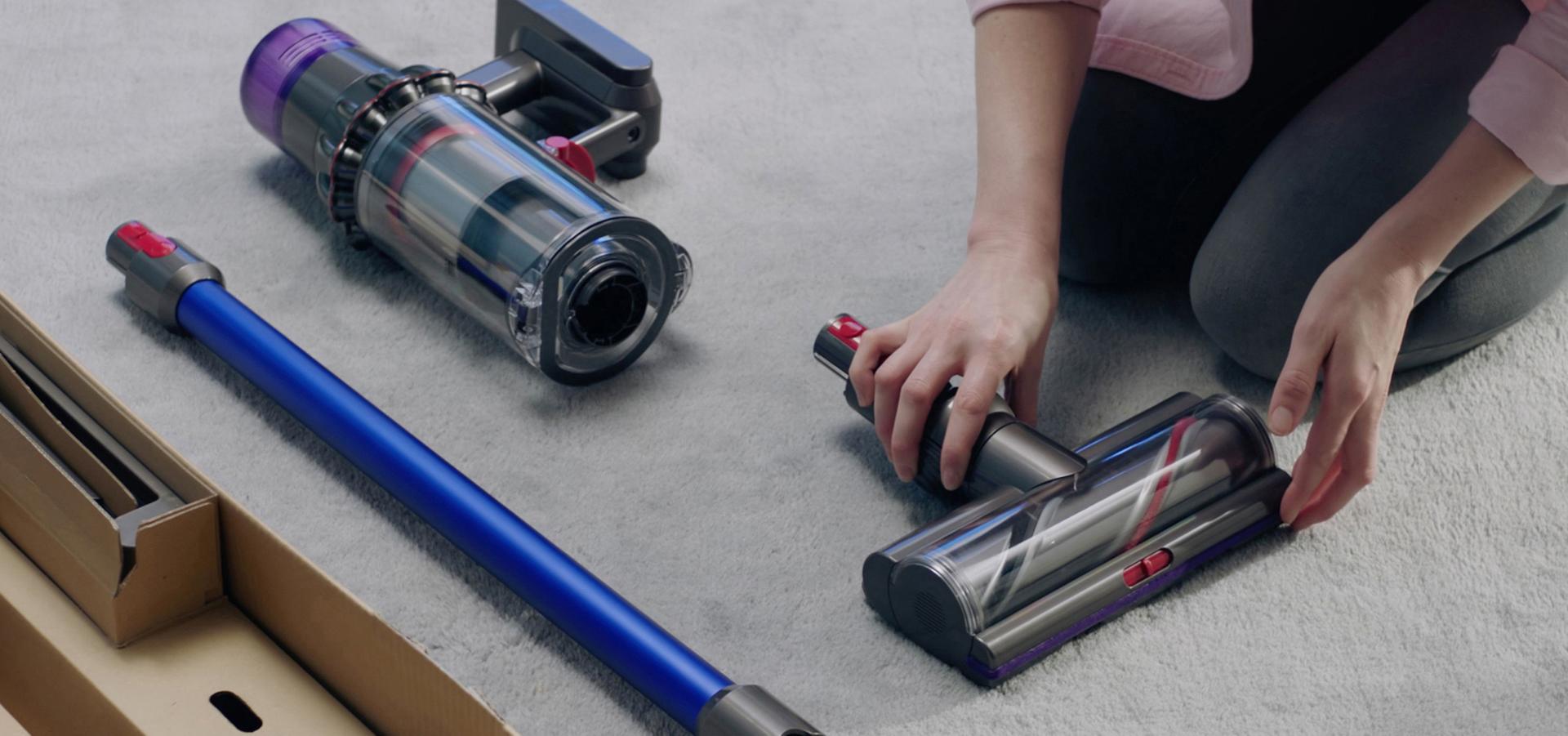 Dyson Outsize vacuum being assembled on the floor.