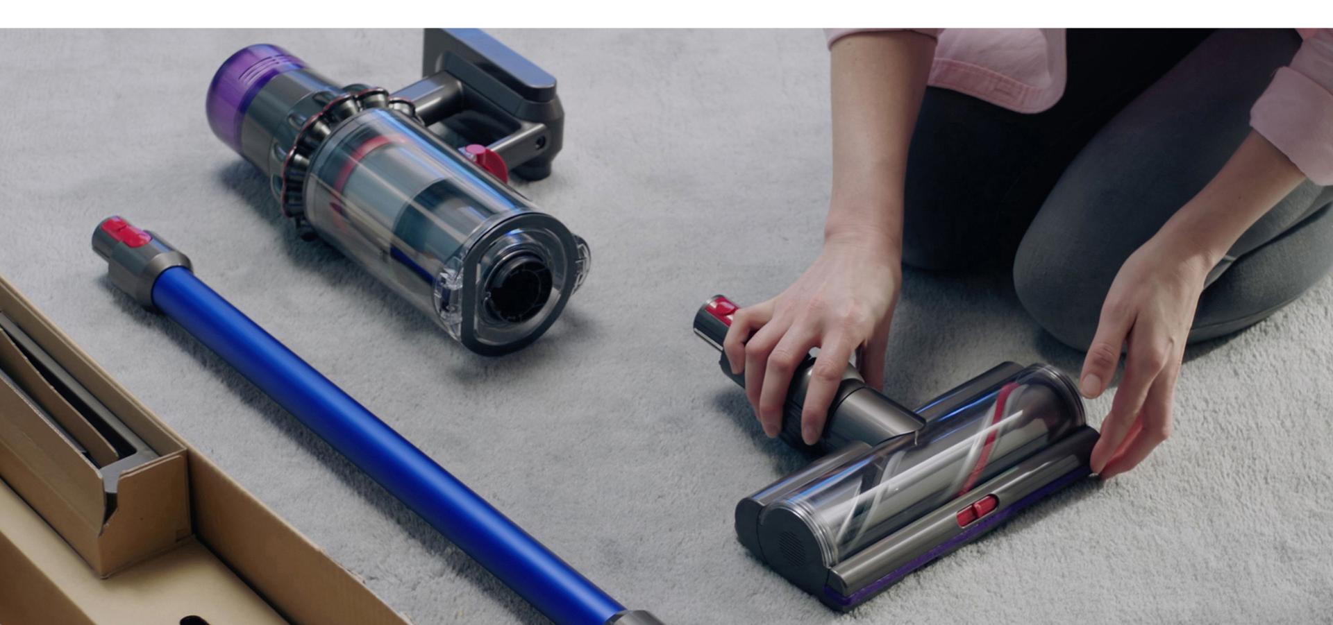 Dyson V11 vacuum being assembed on the floor.