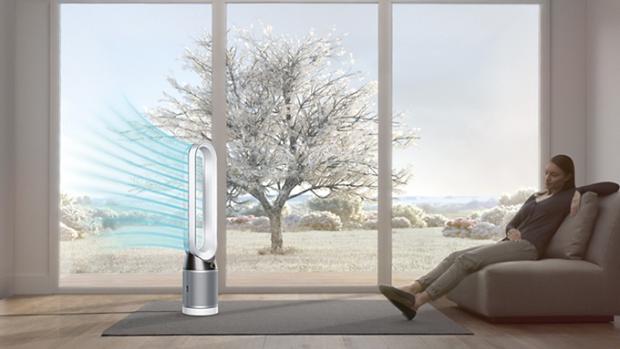 Woman being purified with the Dyson Pure Cool purifying fan