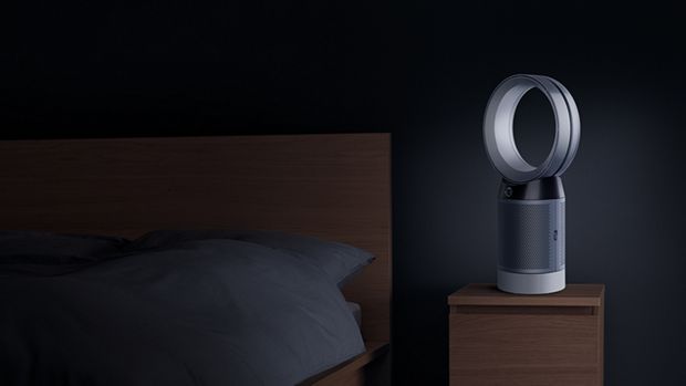 Desk purifier beside bed at night