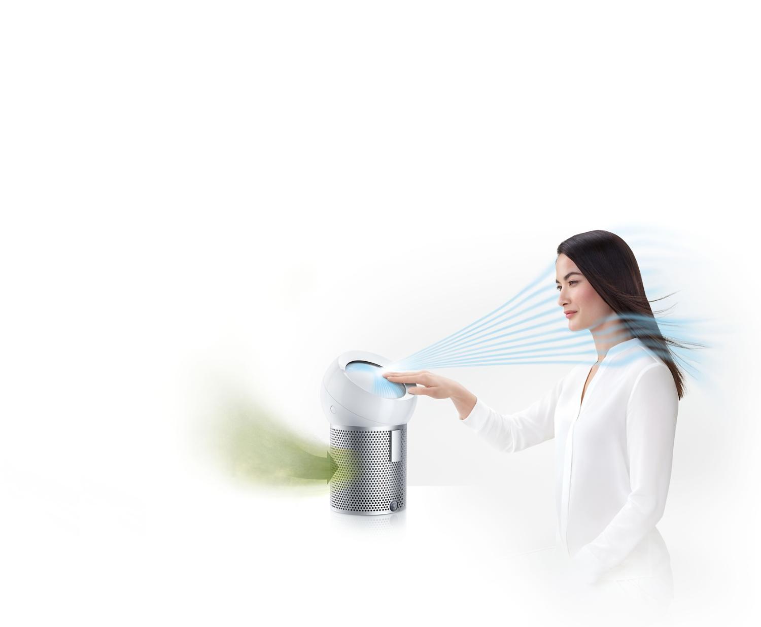A woman using the Dyson Pure Cool Me personal purifier fan to project cooling, purified air