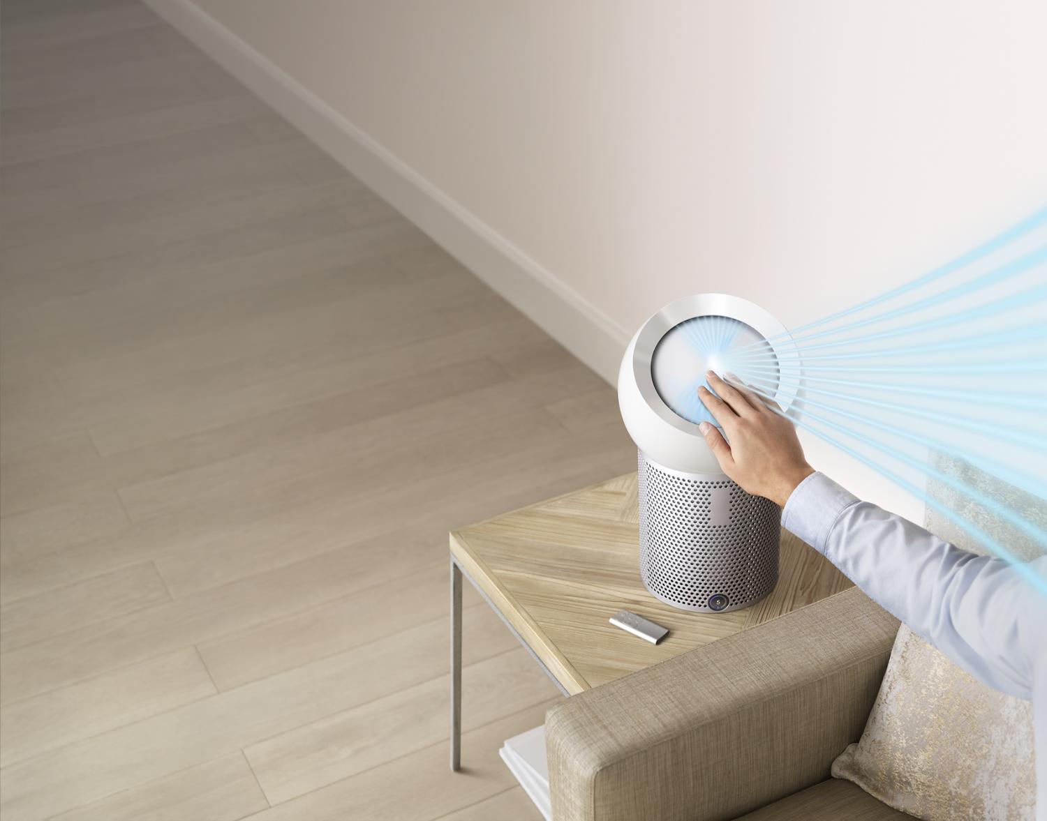 Hand reaching out to refocus airflow with Dyson Core Flow technology