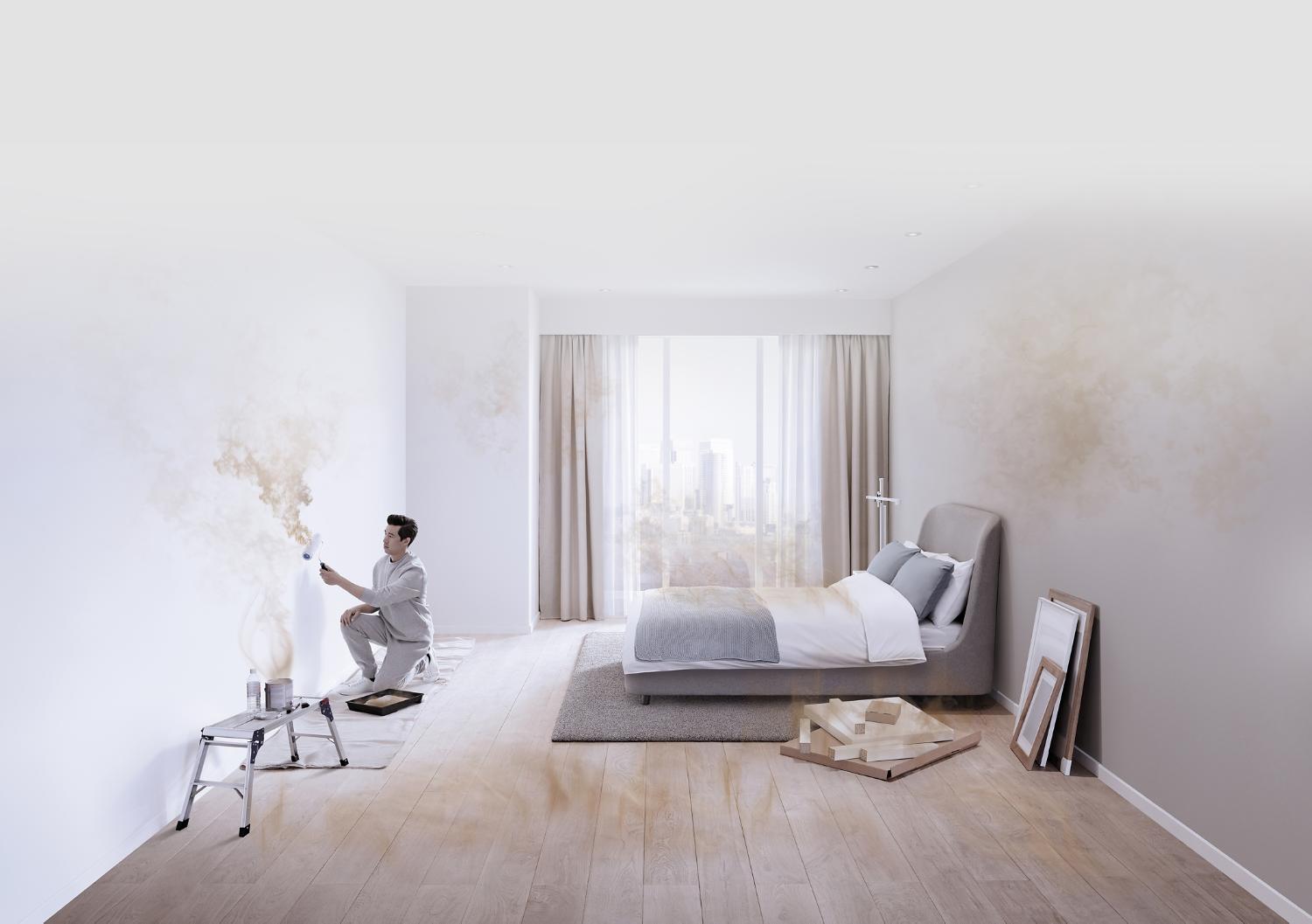 A man paints a room, while particles and gases pollute the air around him