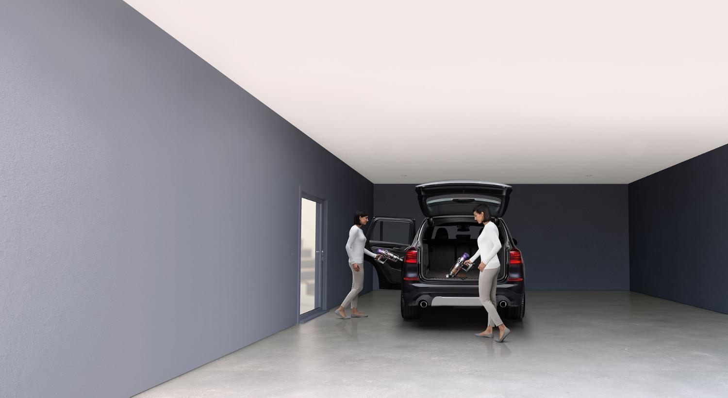 Dyson Cyclone V10™ vacuum in handheld mode cleaning car interior