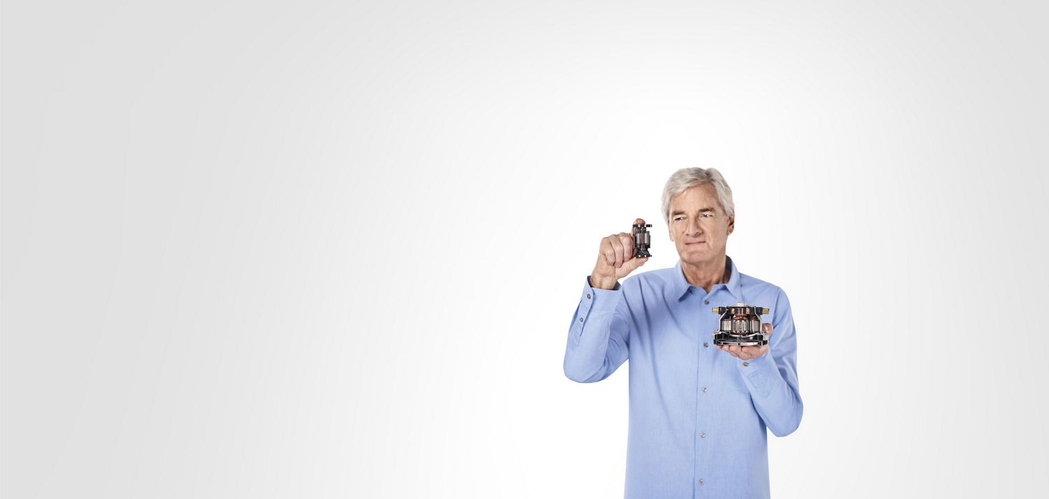 James Dyson holding Dyson digital vacuum cleaner motor V10 James Dyson holding Dyson digital vacuum cleaner motor V10