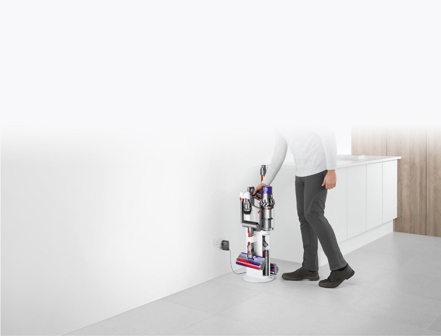 Dyson Cyclone V10 Dok™ plugged into wall