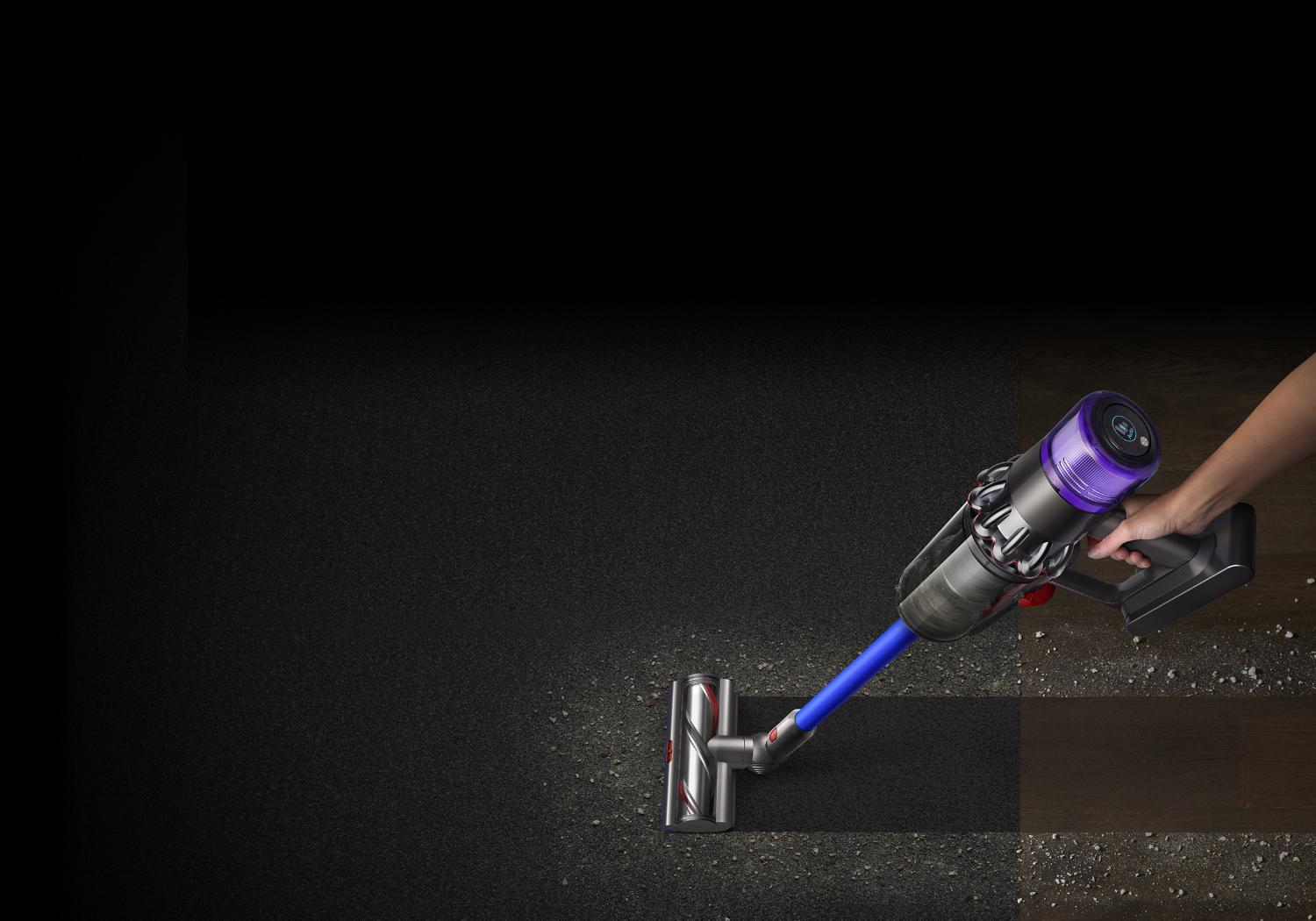 Woman with Dyson V11™ vacuum cleaning floor and ceiling