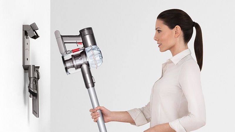 Model with Dyson wall-mounted dock