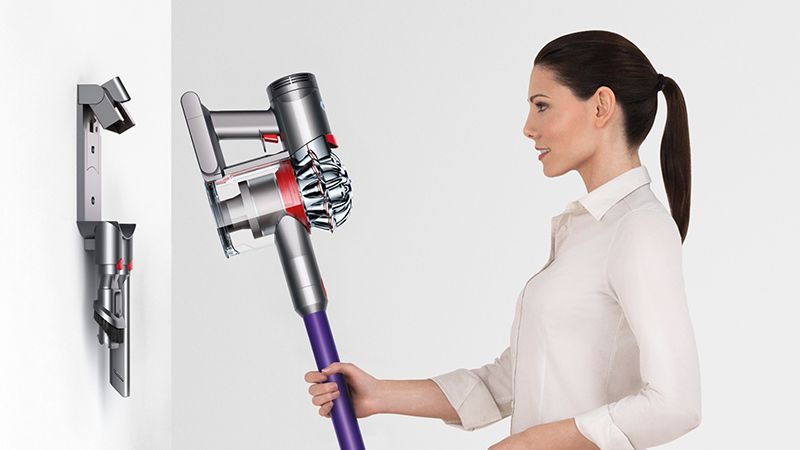 Model with Dyson wall-mounted dock