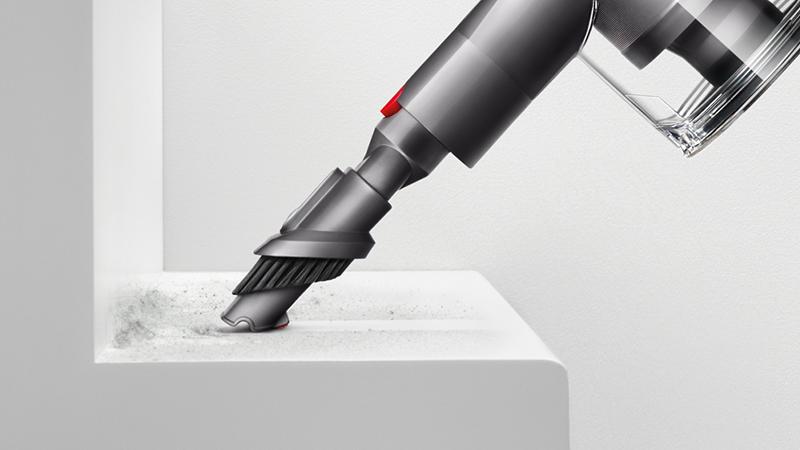 Dyson V7 HEPA vacuum cleaner combination tool on shelf