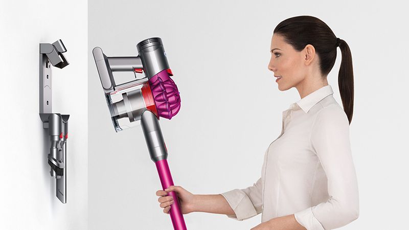 Model with Dyson wall-mounted dock