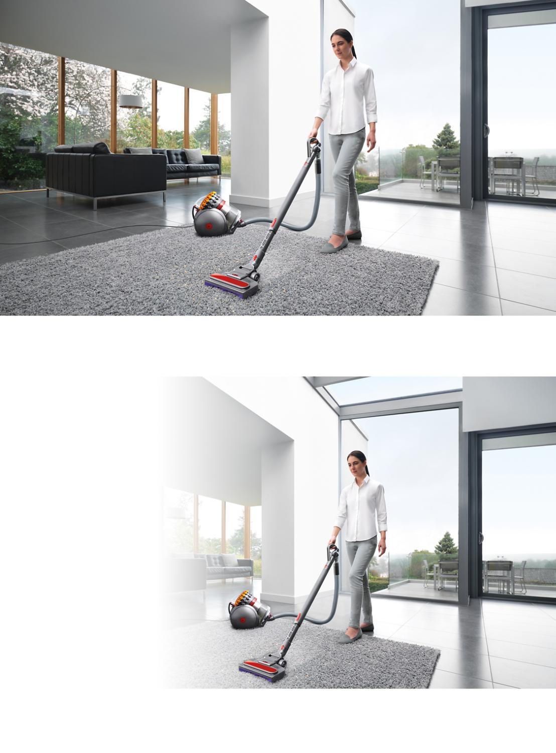 Modell verwendet einen Dyson Big Ball, um einen Läufer im Wohnzimmer zu reinigen.